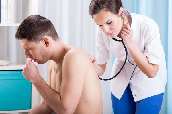 Coughing man having examination — Stock Photo, Image