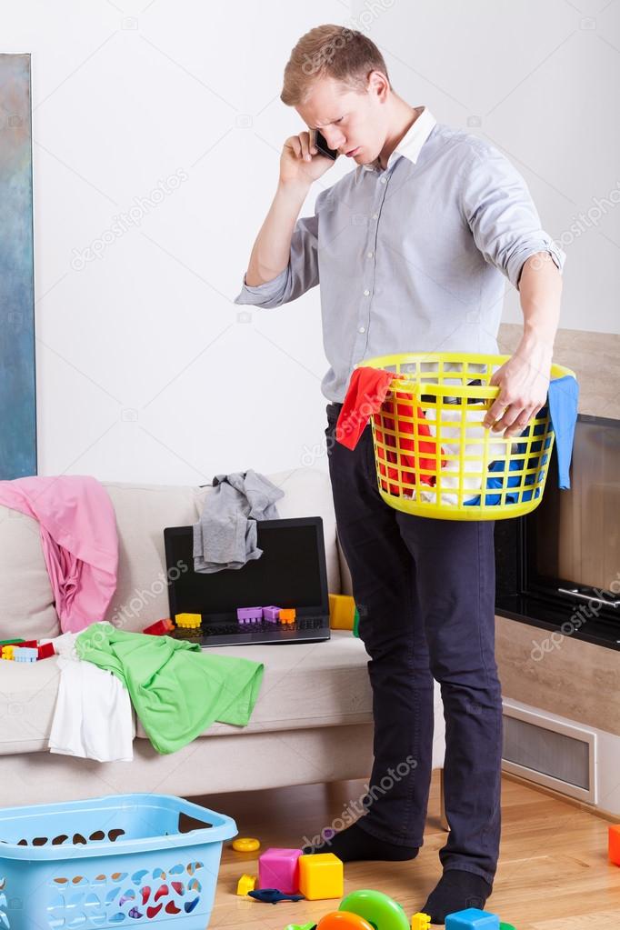 Businessman collecting dirty clothes