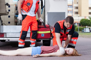 Paramedics applying first aid