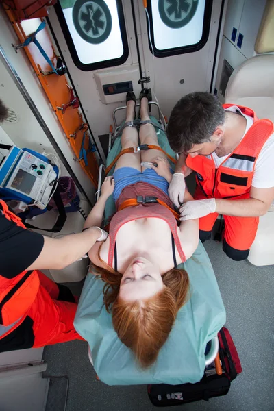 Paramedics using medical equipment — Stock Photo, Image