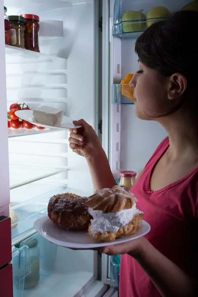 Hungry woman in the kitchen — Stock Photo, Image