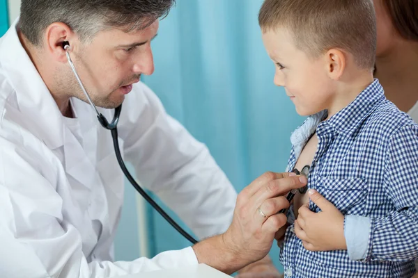 Pediatrician listening preschooler heart Stock Picture