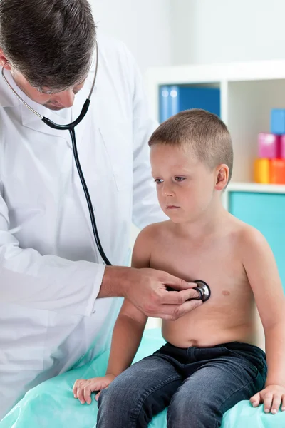 Doctor examining little patient Royalty Free Stock Images