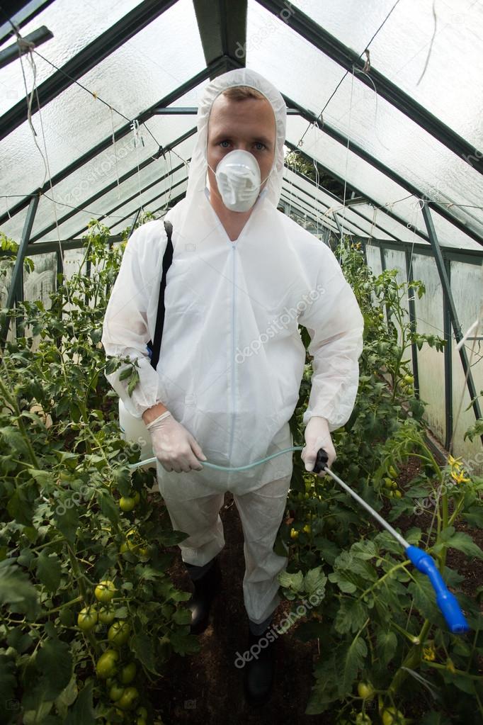 Gardener in protective clothing