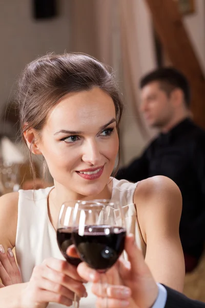 Young couple raising a toast — Stock Photo, Image