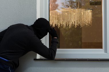 Burglar at a window clipart