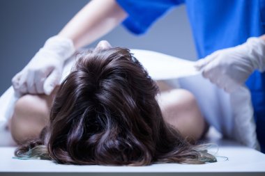 Nurse covering the dead body clipart
