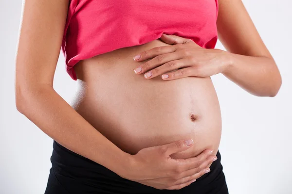 Pregnant woman's belly — Stock Photo, Image