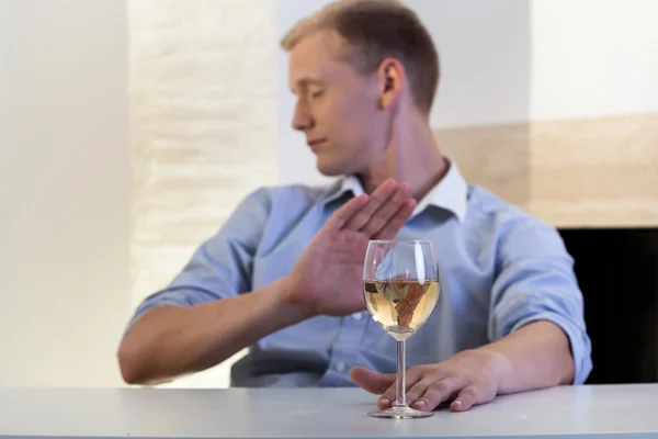 Man refuses to drink a glass of wine — Stock Photo, Image