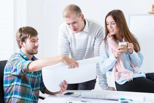 Young people working in pleasant atmosphere — Stock Photo, Image