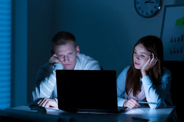 Young people working overtime — Stock Photo, Image