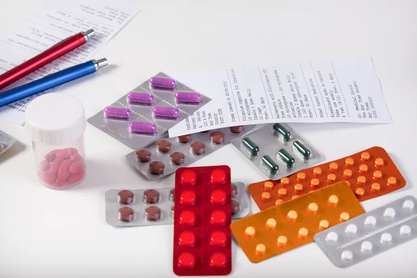 Table with prescriptions and pharmaceuticals — Stock Photo, Image