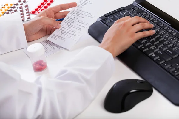 Pharmacist realizing rx paper — Stock Photo, Image