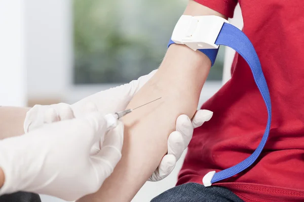 Nurse's hands taking blood sample — Stock Photo, Image