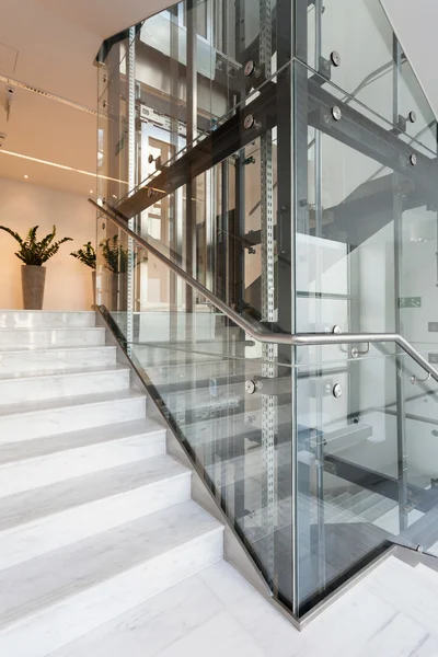 Glass elevator in modern building