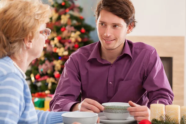 Grandson talking with grandmother — Stock Photo, Image