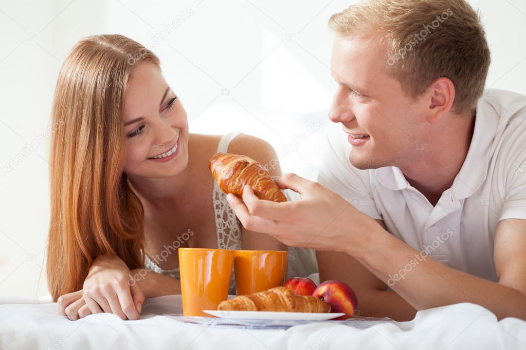 Husband feeding his wife