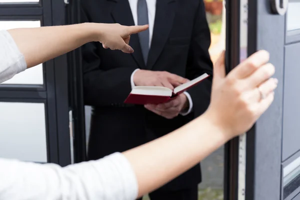 Ordering Jehovah's witness to go out — Stock Photo, Image