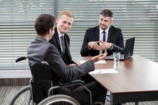 Businessman on a wheelchair — Stock Photo, Image