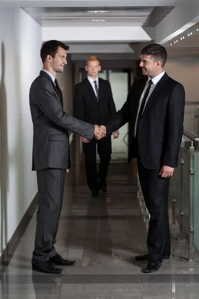 Businessmen shaking hands Stock Photo