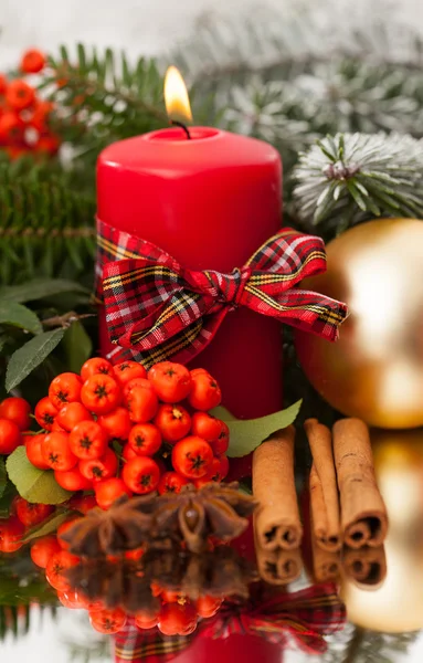 Christmas candle on a table — Stock Photo, Image