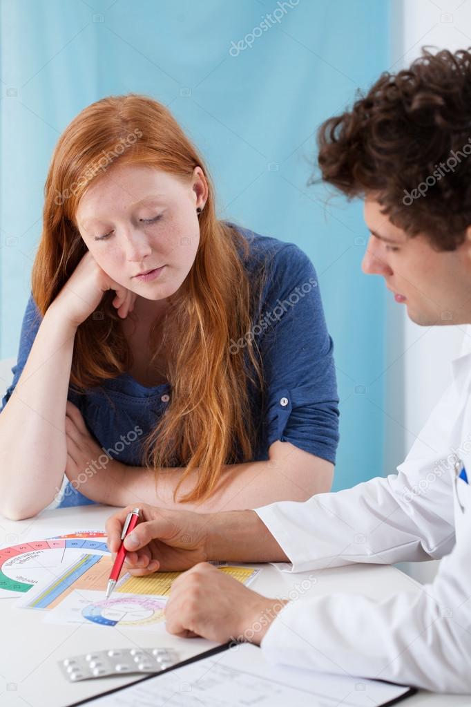 Gynecologist explaining natural family planning Stock Photo by ©photographee.eu 57499499