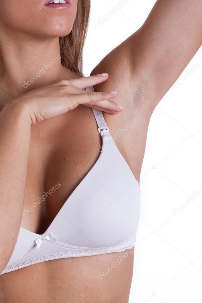 Woman with clean-shaven armpit