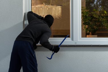 Burglar before burglary into the house clipart