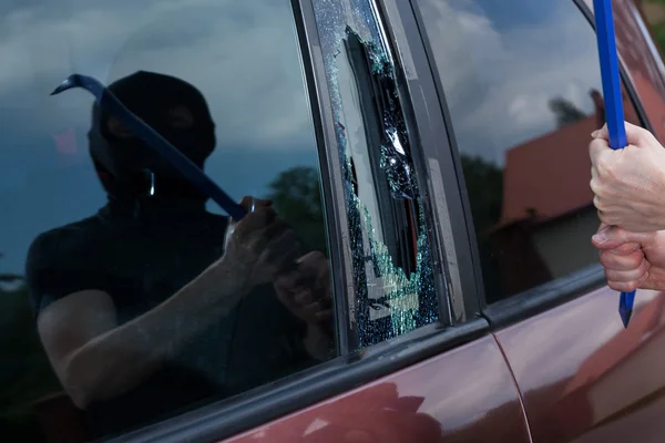 Car robber with crowbar — Stock Photo, Image