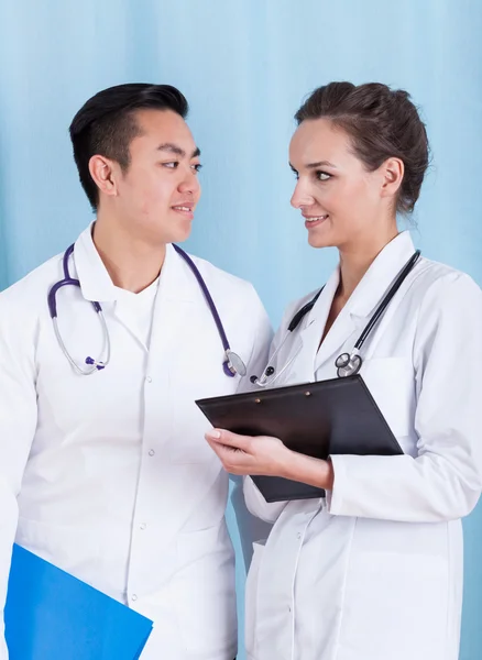 Professional doctors talking at work — Stock Photo, Image