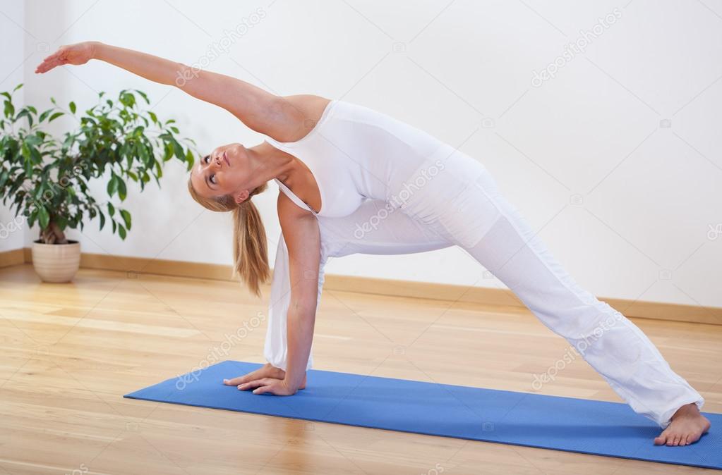 Middle Aged Woman Doing Expert Yoga Stock Photo - Download Image