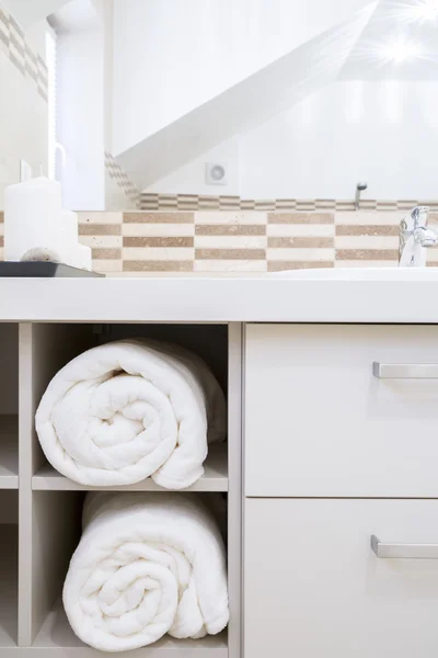 Towels in modern bathroom's cupboard — Stock Photo, Image