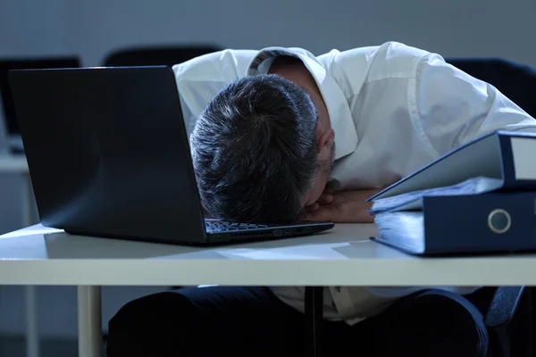 Businessman overwhelmed by problems at work — Stock Photo, Image