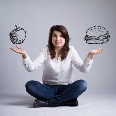 Girl with a dilemma about food clipart