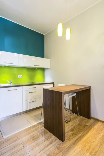 Small dining space in green kitchen — Stock Photo, Image