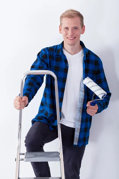 Young man on ladder — Stock Photo, Image