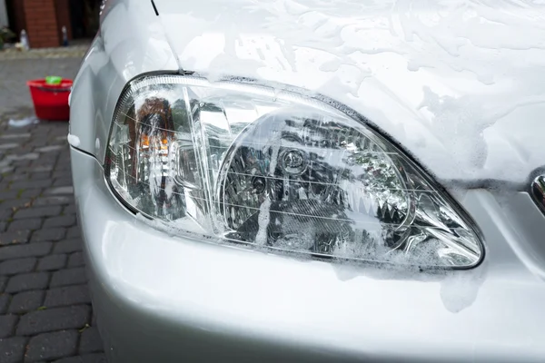 Soap suds on a headlight — Stock Photo, Image