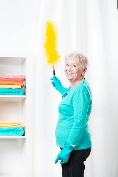 Dusting the curtains — Stock Photo, Image