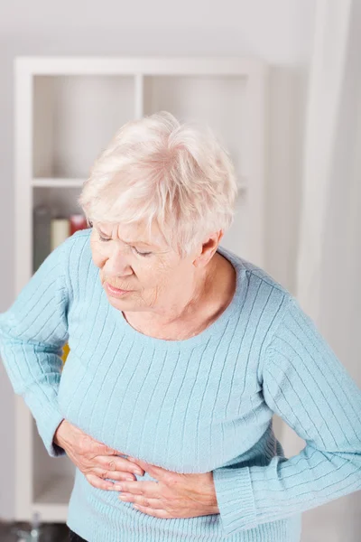 Dama y dolor de estómago — Foto de Stock