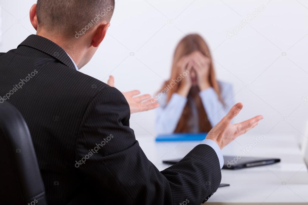 Girl crying on a conversation with employer