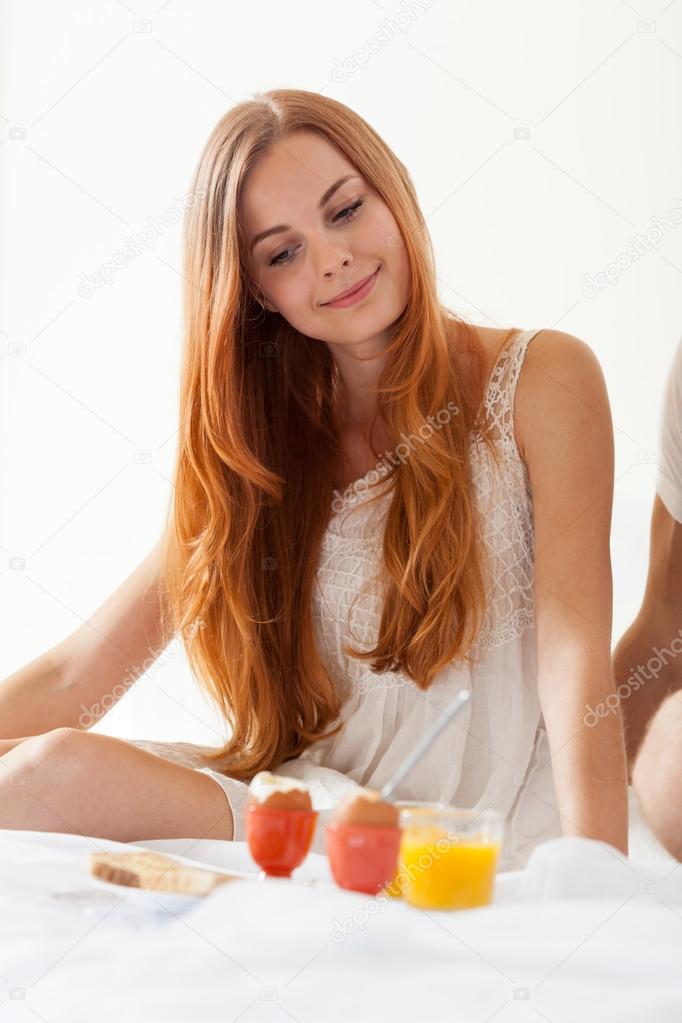 Women eating brakfast in bedroom
