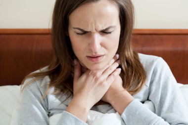 Woman having a sore throat clipart