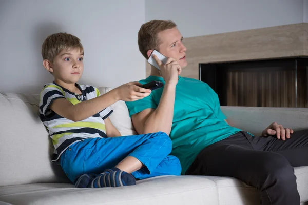 Sitting on the sofa — Stock Photo, Image