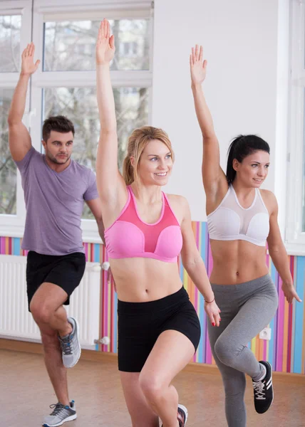 Sporty people exercising together — Stock Photo, Image