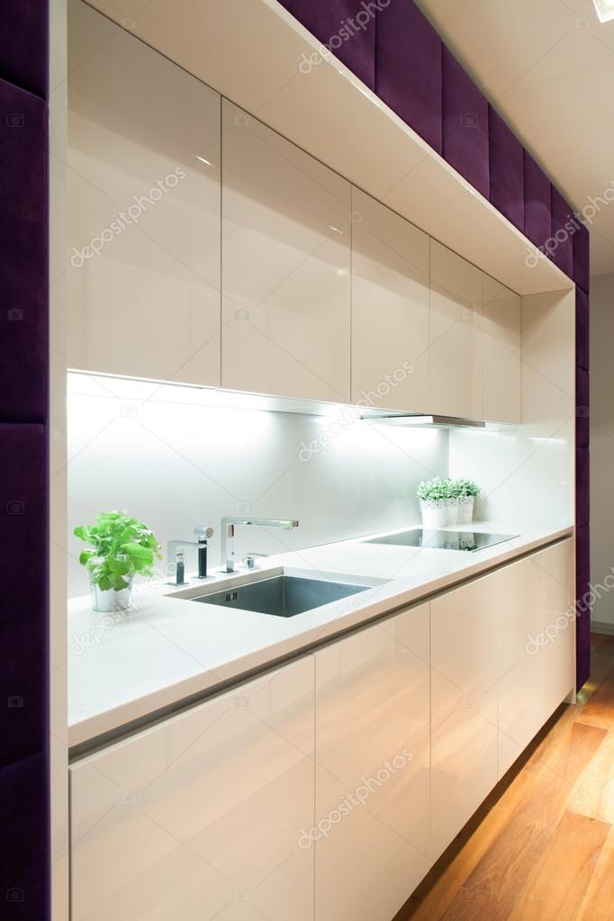 White kitchen with purple elements
