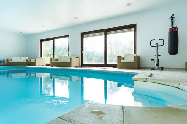 Swimming pool inside expensive house — Stock Photo, Image
