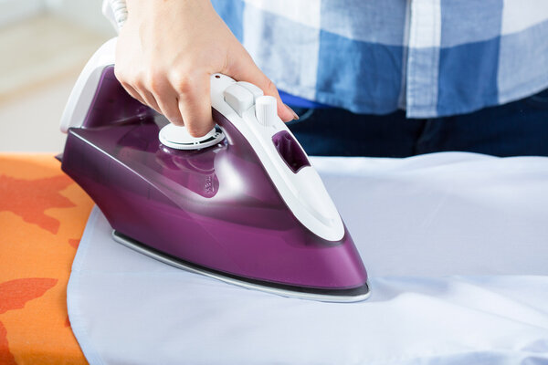 Close-up of ironing