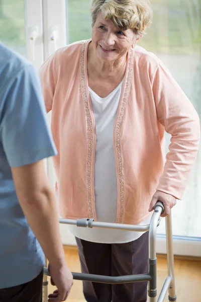 Woman with walker — Stock Photo, Image