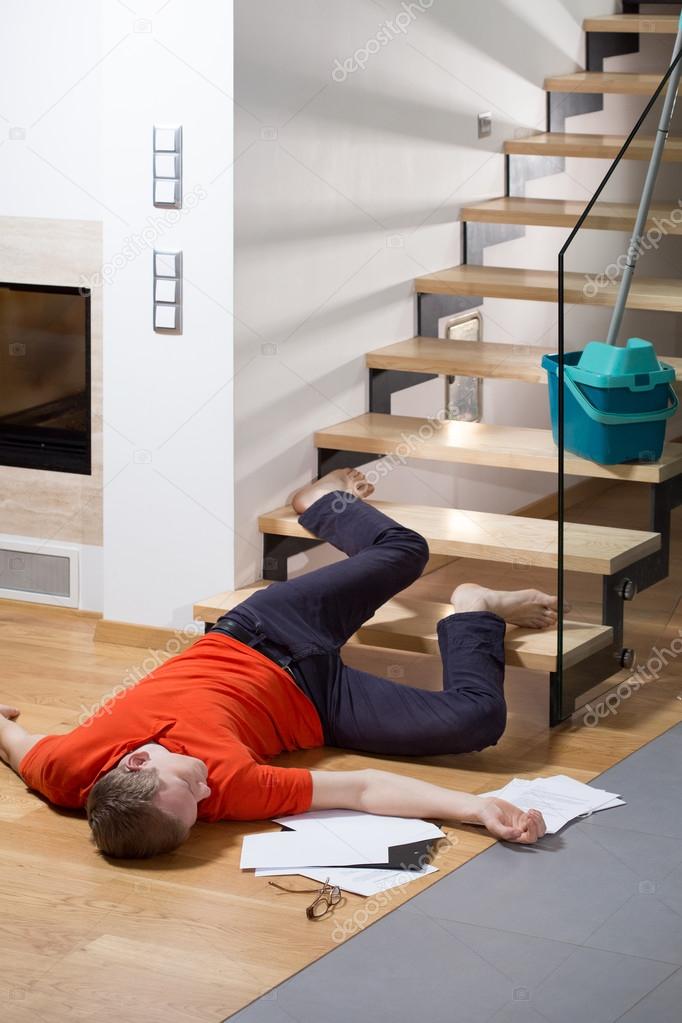 Injured man lying on the floor