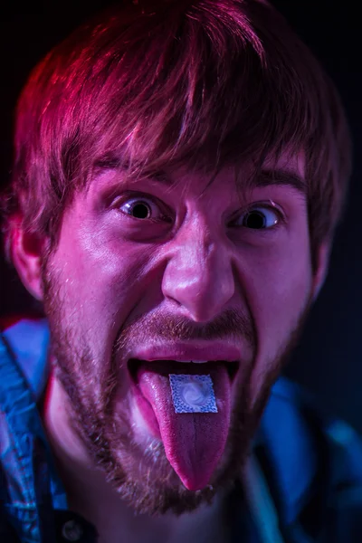 Taking ecstasy pill — Stock Photo, Image